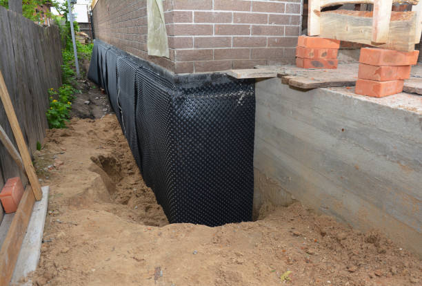 Happy homeowners after waterproofing job in Perrinton
